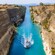 A boat sailing through a narrow canal